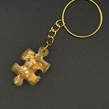 Porte-clef pièce de puzzle feuilles métallisées dorées
